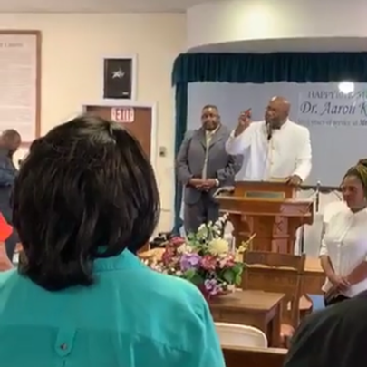 Pastor Green preaching in pulpit